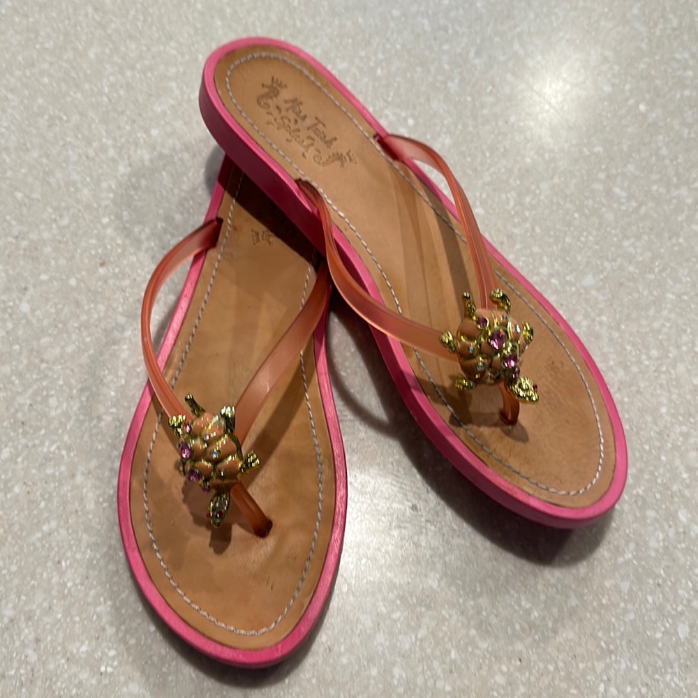 Miss Trish Splash flip flops with jelly straps and turtle embellishments.